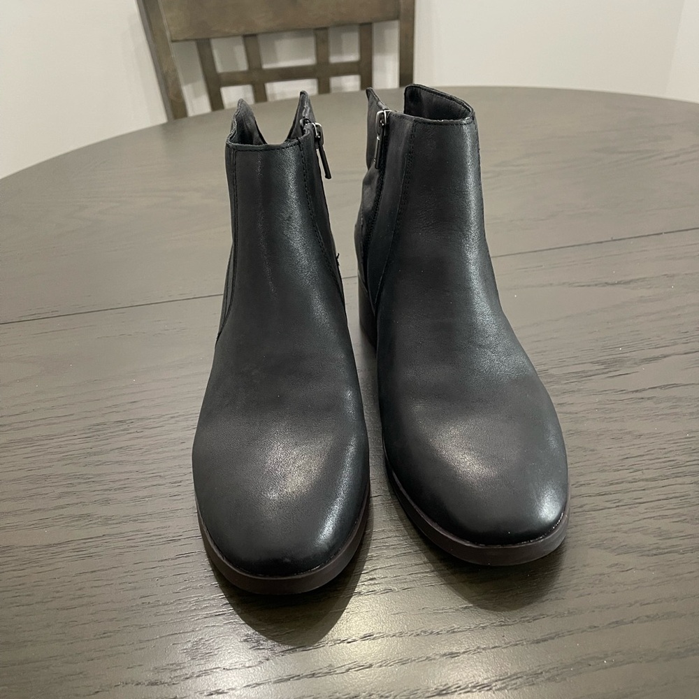 Black ankle boots never worn side zip original box size 9 1/2 wide.